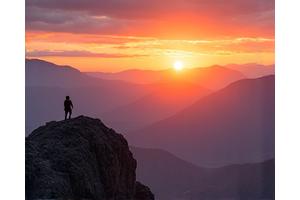 Scenic view of Boulder Flatirons with a person hiking, representing altitude wellness.