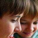 Parent and child engaged in a quiet, mindful activity like reading together, symbolizing family balance.